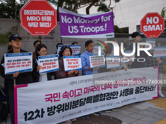 Members of the group People for Peace and Reunification hold a protest in front of the Ministry of Foreign Affairs, opposing the Special Mea...