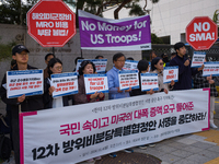 Members of the group People for Peace and Reunification hold a protest in front of the Ministry of Foreign Affairs, opposing the Special Mea...