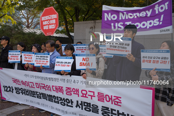 Members of the group People for Peace and Reunification hold a protest in front of the Ministry of Foreign Affairs, opposing the Special Mea...