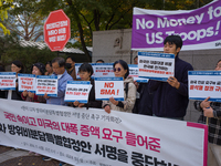 Members of the group People for Peace and Reunification hold a protest in front of the Ministry of Foreign Affairs, opposing the Special Mea...