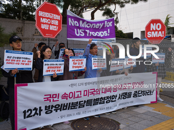 Members of the group People for Peace and Reunification hold a protest in front of the Ministry of Foreign Affairs, opposing the Special Mea...