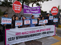 Members of the group People for Peace and Reunification hold a protest in front of the Ministry of Foreign Affairs, opposing the Special Mea...