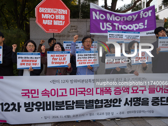 Members of the group People for Peace and Reunification hold a protest in front of the Ministry of Foreign Affairs, opposing the Special Mea...