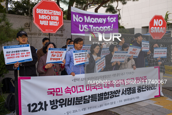 Members of the group People for Peace and Reunification hold a protest in front of the Ministry of Foreign Affairs, opposing the Special Mea...