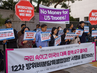 Members of the group People for Peace and Reunification hold a protest in front of the Ministry of Foreign Affairs, opposing the Special Mea...