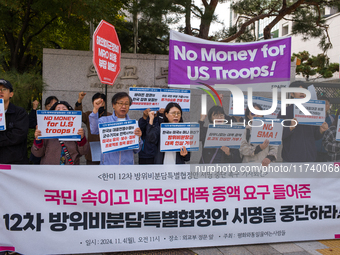 Members of the group People for Peace and Reunification hold a protest in front of the Ministry of Foreign Affairs, opposing the Special Mea...