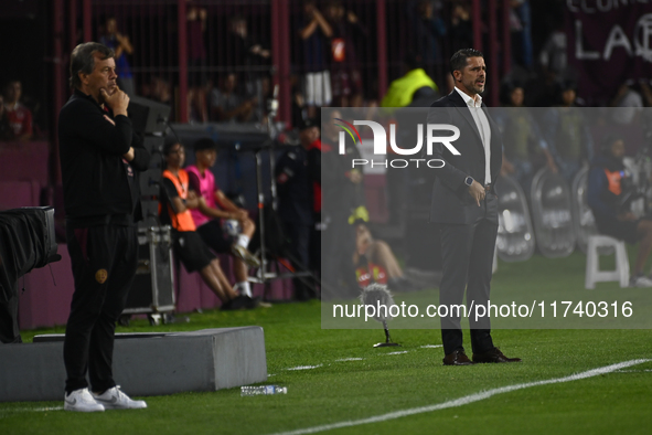 Fernando Gago and Ricardo Zielinski, coaches of Boca Jrs and Lanus, give instructions to their team players during a Liga Profesional 2024 m...