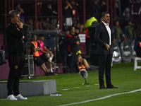 Fernando Gago and Ricardo Zielinski, coaches of Boca Jrs and Lanus, give instructions to their team players during a Liga Profesional 2024 m...