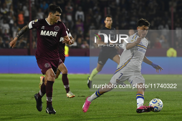 Exequiel Zeballos of Boca Jrs competes for the ball against Ezequiel Munoz of Lanus during a Liga Profesional 2024 match between Lanus and B...