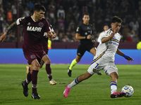 Exequiel Zeballos of Boca Jrs competes for the ball against Ezequiel Munoz of Lanus during a Liga Profesional 2024 match between Lanus and B...