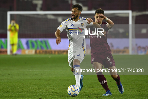 Marcelo Saracchi of Boca Jrs competes for the ball against Felipe Pena Biafore of Lanus during a Liga Profesional 2024 match between Lanus a...