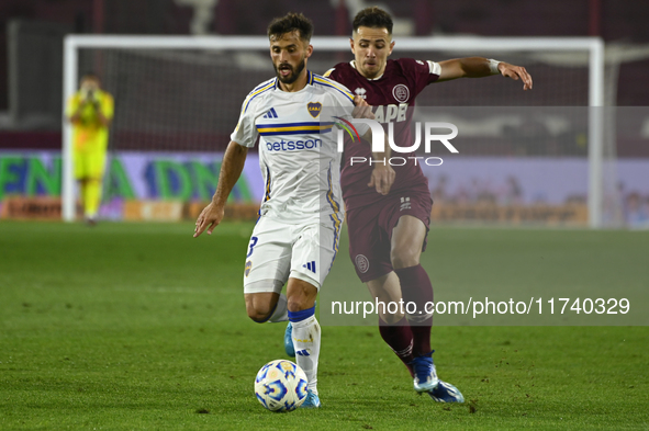 Marcelo Saracchi of Boca Jrs competes for the ball against Felipe Pena Biafore of Lanus during a Liga Profesional 2024 match between Lanus a...