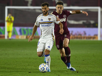 Marcelo Saracchi of Boca Jrs competes for the ball against Felipe Pena Biafore of Lanus during a Liga Profesional 2024 match between Lanus a...