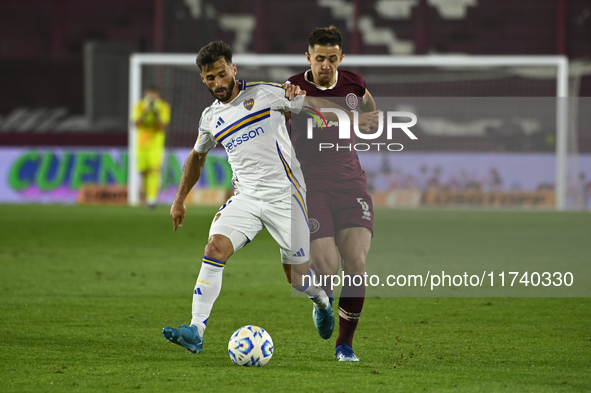 Marcelo Saracchi of Boca Jrs competes for the ball against Felipe Pena Biafore of Lanus during a Liga Profesional 2024 match between Lanus a...