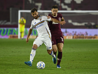 Marcelo Saracchi of Boca Jrs competes for the ball against Felipe Pena Biafore of Lanus during a Liga Profesional 2024 match between Lanus a...