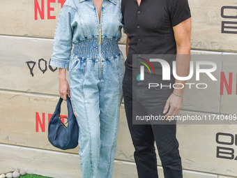 Brianna Brown and Tony Crane arrive at Netflix's Poguelandia 2024 Event Celebrating 'Outer Banks' Season 4 Part 2 held at Barker Hangar on N...