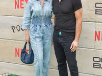 Brianna Brown and Tony Crane arrive at Netflix's Poguelandia 2024 Event Celebrating 'Outer Banks' Season 4 Part 2 held at Barker Hangar on N...