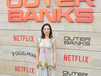 Fiona Palomo arrives at Netflix's Poguelandia 2024 Event Celebrating 'Outer Banks' Season 4 Part 2 held at Barker Hangar on November 2, 2024...