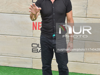 Tony Crane arrives at Netflix's Poguelandia 2024 Event Celebrating 'Outer Banks' Season 4 Part 2 held at Barker Hangar on November 2, 2024 i...