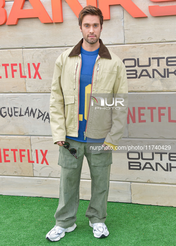 Austin North arrives at Netflix's Poguelandia 2024 Event Celebrating 'Outer Banks' Season 4 Part 2 held at Barker Hangar on November 2, 2024...