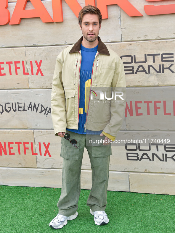 Austin North arrives at Netflix's Poguelandia 2024 Event Celebrating 'Outer Banks' Season 4 Part 2 held at Barker Hangar on November 2, 2024...