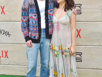 Drew Starkey and Fiona Palomo arrive at Netflix's Poguelandia 2024 Event Celebrating 'Outer Banks' Season 4 Part 2 held at Barker Hangar on...