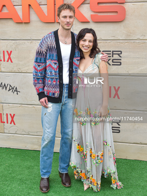 Drew Starkey and Fiona Palomo arrive at Netflix's Poguelandia 2024 Event Celebrating 'Outer Banks' Season 4 Part 2 held at Barker Hangar on...