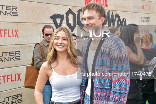 Madelyn Cline and Drew Starkey arrive at Netflix's Poguelandia 2024 Event Celebrating 'Outer Banks' Season 4 Part 2 held at Barker Hangar on...