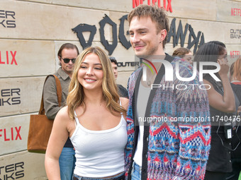 Madelyn Cline and Drew Starkey arrive at Netflix's Poguelandia 2024 Event Celebrating 'Outer Banks' Season 4 Part 2 held at Barker Hangar on...