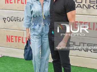 Brianna Brown and Tony Crane arrive at Netflix's Poguelandia 2024 Event Celebrating 'Outer Banks' Season 4 Part 2 held at Barker Hangar on N...