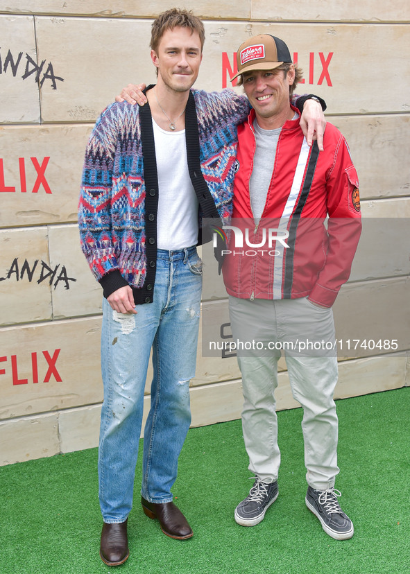 Drew Starkey and Jonas Pate arrive at Netflix's Poguelandia 2024 Event Celebrating 'Outer Banks' Season 4 Part 2 held at Barker Hangar on No...