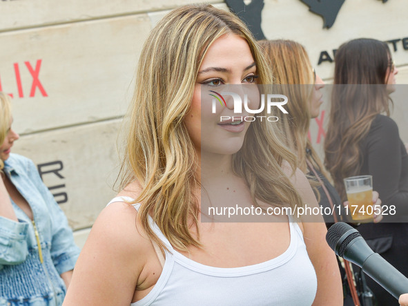 Madelyn Cline arrives at Netflix's Poguelandia 2024 Event Celebrating 'Outer Banks' Season 4 Part 2 held at Barker Hangar on November 2, 202...