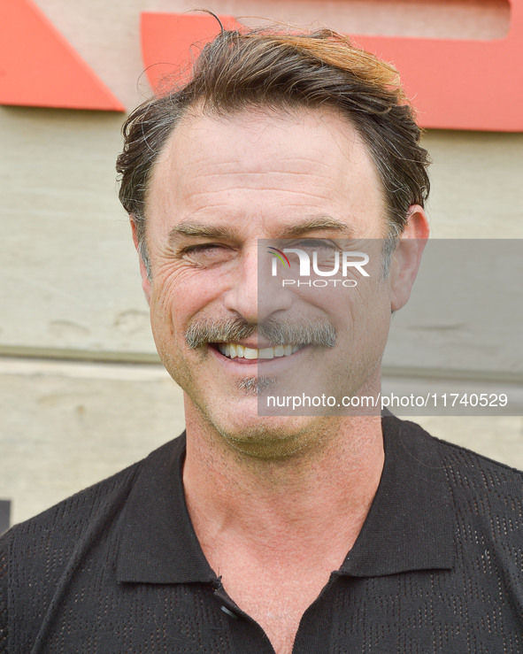 Tony Crane arrives at Netflix's Poguelandia 2024 Event Celebrating 'Outer Banks' Season 4 Part 2 held at Barker Hangar on November 2, 2024 i...