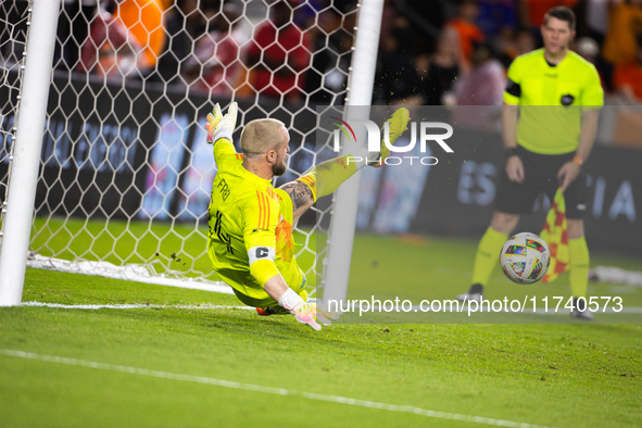 Seattle Sounders goalkeeper Stefan Frei makes the match-winning save during a penalty shoot-out, blocking a shot from Houston Dynamo defende...