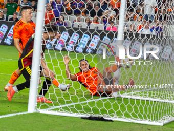 Houston Dynamo player Griffin Dorsey slides into Seattle's net after deflecting the ball off Seattle Sounders defender Alex Roldan for an ow...