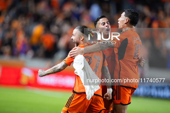 Houston Dynamo players celebrate after a goal during a playoff match in Houston, Texas, on November 3, 2024, at Shell Energy Stadium. 