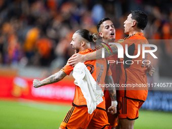 Houston Dynamo players celebrate after a goal during a playoff match in Houston, Texas, on November 3, 2024, at Shell Energy Stadium. (