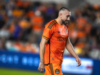 Houston Dynamo captain Hector Herrera walks off the pitch after receiving a red card during a playoff match between Houston Dynamo and Seatt...