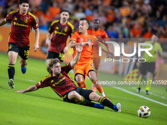 Seattle Sounders forward Pedro de la Vega battles for the ball with Houston Dynamo midfielder Amine Bassi during a playoff match between Hou...