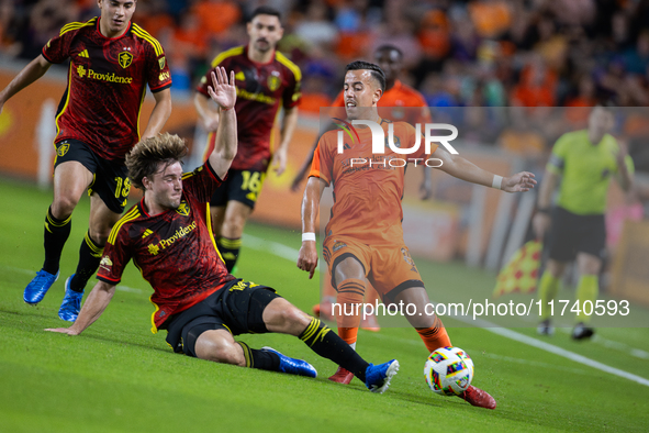 Seattle Sounders forward Pedro de la Vega battles for the ball with Houston Dynamo midfielder Amine Bassi during a playoff match between Hou...