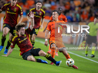 Seattle Sounders forward Pedro de la Vega battles for the ball with Houston Dynamo midfielder Amine Bassi during a playoff match between Hou...