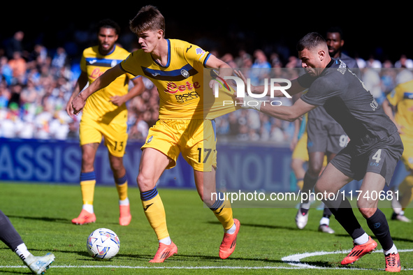 Charles De Ketelaere of Atalanta BC and Alessandro Buongiorno of SSC Napoli compete for the ball during the serie Serie A Enilive match betw...