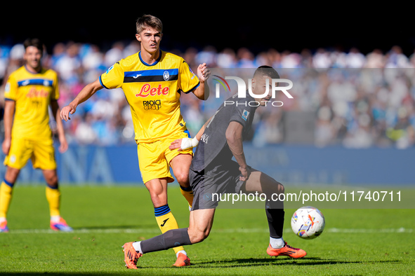 Charles De Ketelaere of Atalanta BC and Alessandro Buongiorno of SSC Napoli compete for the ball during the serie Serie A Enilive match betw...