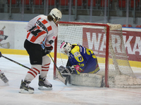 A hockey match takes place between KS Cracovia 1906 (reds) and MMKS Podhale Nowy Targ (blues) at the Adam 'Roch' Kowalski ice rink on the oc...