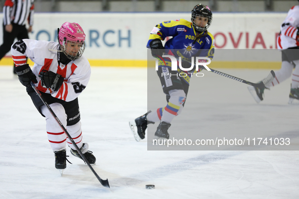 A hockey match takes place between KS Cracovia 1906 (reds) and MMKS Podhale Nowy Targ (blues) at the Adam 'Roch' Kowalski ice rink on the oc...