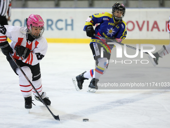 A hockey match takes place between KS Cracovia 1906 (reds) and MMKS Podhale Nowy Targ (blues) at the Adam 'Roch' Kowalski ice rink on the oc...