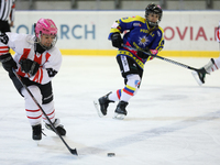 A hockey match takes place between KS Cracovia 1906 (reds) and MMKS Podhale Nowy Targ (blues) at the Adam 'Roch' Kowalski ice rink on the oc...