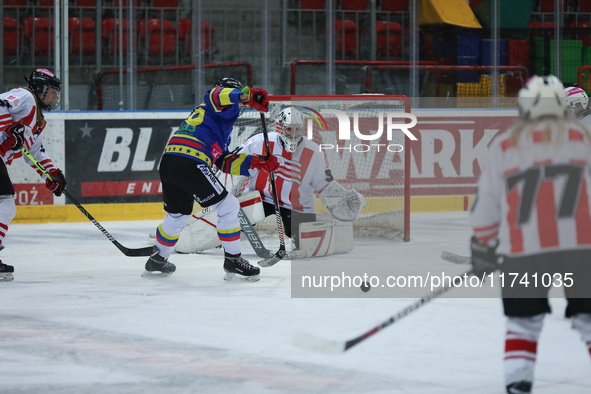 A hockey match takes place between KS Cracovia 1906 (reds) and MMKS Podhale Nowy Targ (blues) at the Adam 'Roch' Kowalski ice rink on the oc...