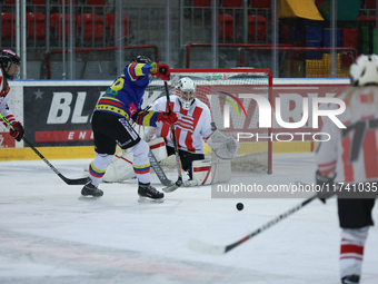 A hockey match takes place between KS Cracovia 1906 (reds) and MMKS Podhale Nowy Targ (blues) at the Adam 'Roch' Kowalski ice rink on the oc...