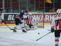 A hockey match takes place between KS Cracovia 1906 (reds) and MMKS Podhale Nowy Targ (blues) at the Adam 'Roch' Kowalski ice rink on the oc...